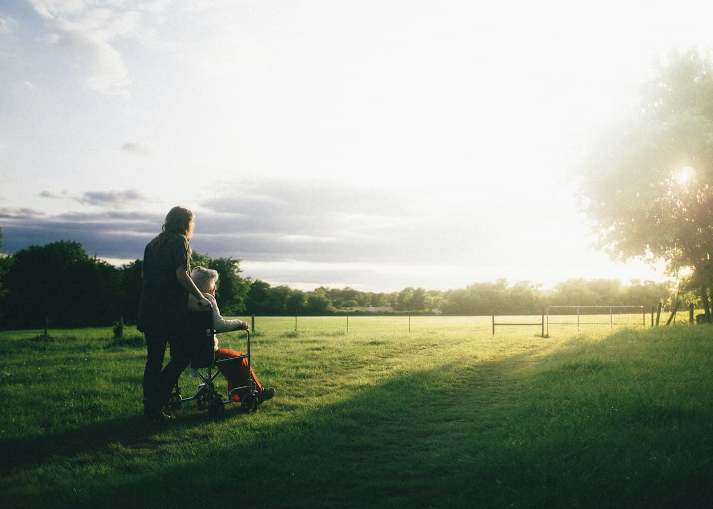 A caregiver supporting a patient — inclusive, compassionate care